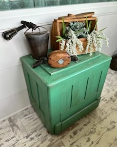 featured antiques on a green side table